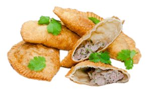 Chebureki - a large deep fried meat turnover. Somewhat similar to empanada and pot stickers.